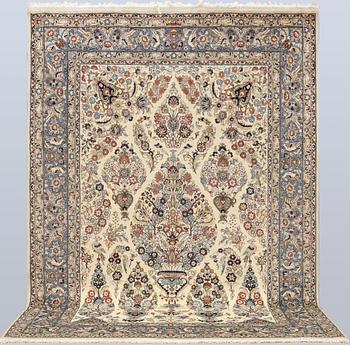 A Shareza carpet, signed, approx. 358 x 254 cm.