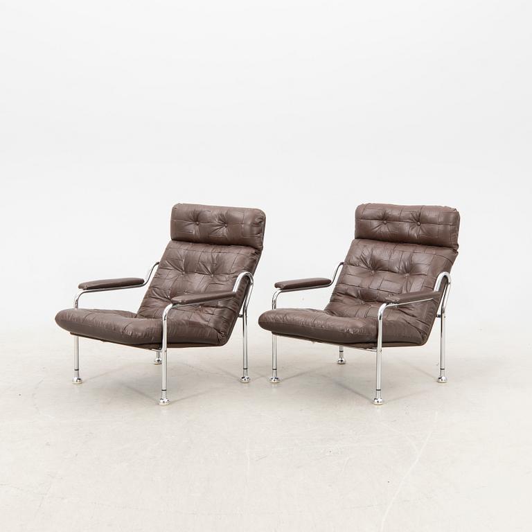 A pair of "Stålbo" easy chairs by Bo Eigert for B. Eigert AB Hova Sweden 1970:s.