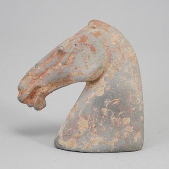 A pottery model of a horses head, Han dynasty (206 BC-220 AD).