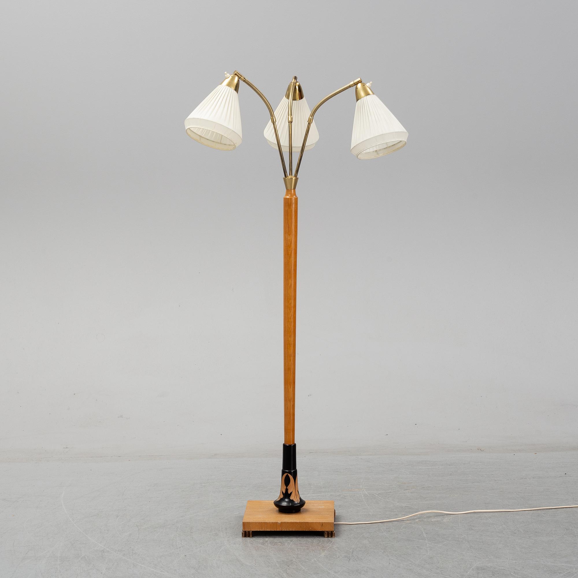 An elm floor light, mid 20th Century.