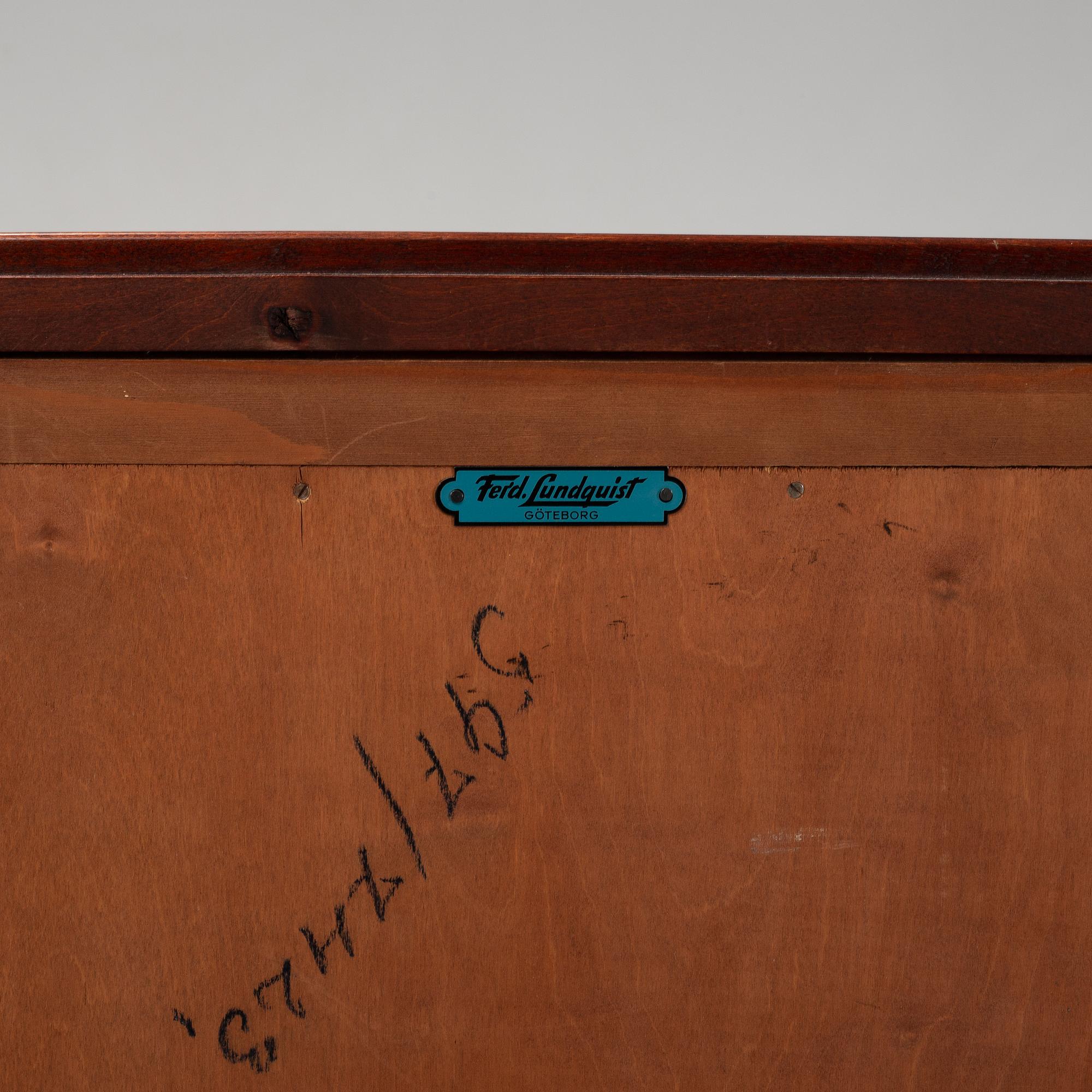 A pair of mahgany veneered bedside cabinets, early 20th Century.