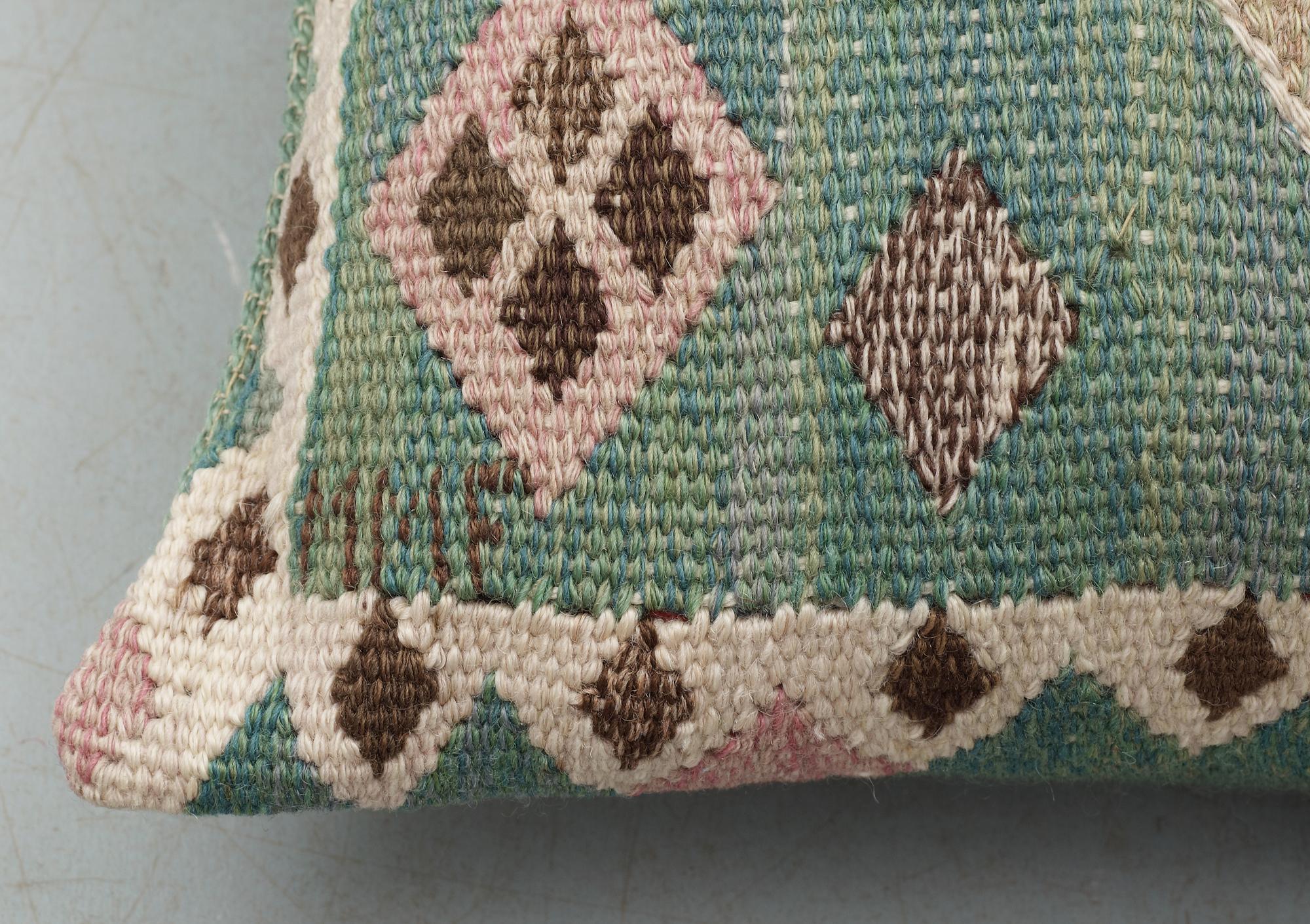 CUSHIONS. one pair. "Knoppen". Gobelängteknik (tapestry weave). 34 x 47  cm each. Signed MMF.