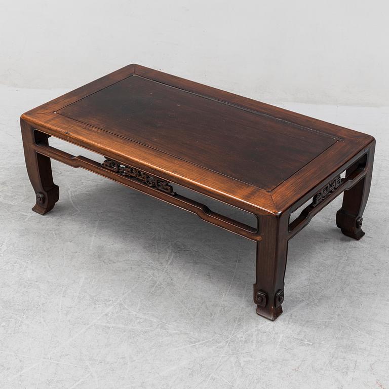 A Chinese hardwood low table, 20th Century.