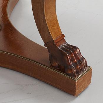 A mahogany veneered Empire style table, first half the 20th Century.