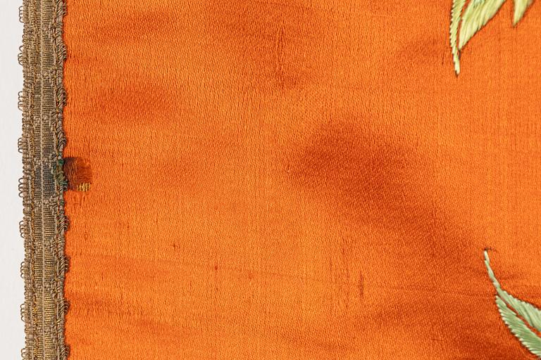 A Chinese embroidered textil fragment, late Qing dynasty/early 20th Century.