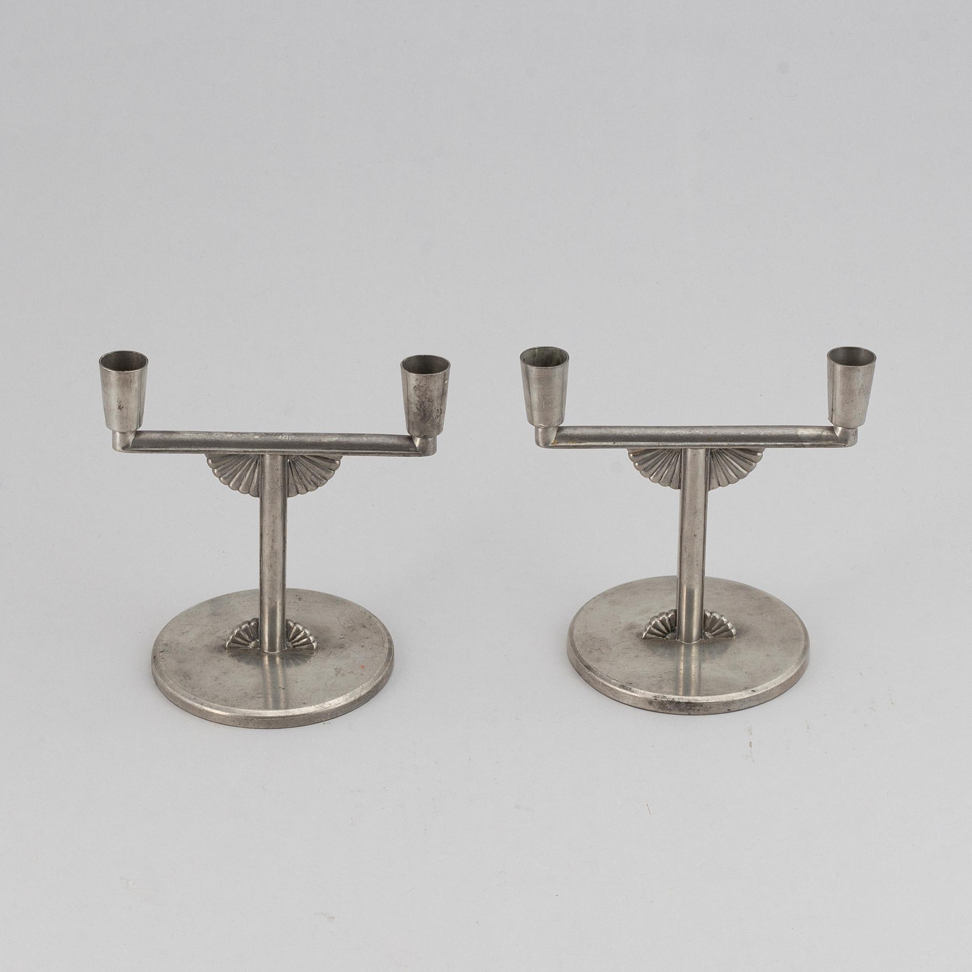 A pair of 1935 pewter candelabras by K E & Co.