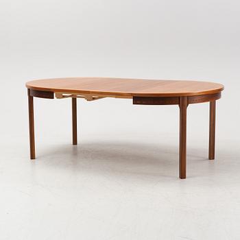 A 'Rimbo' walnut dining table and four chairs, second half of the 20th Century.