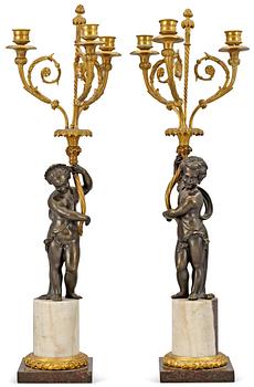 1029. A pair of French 19th century three-light candelabra.