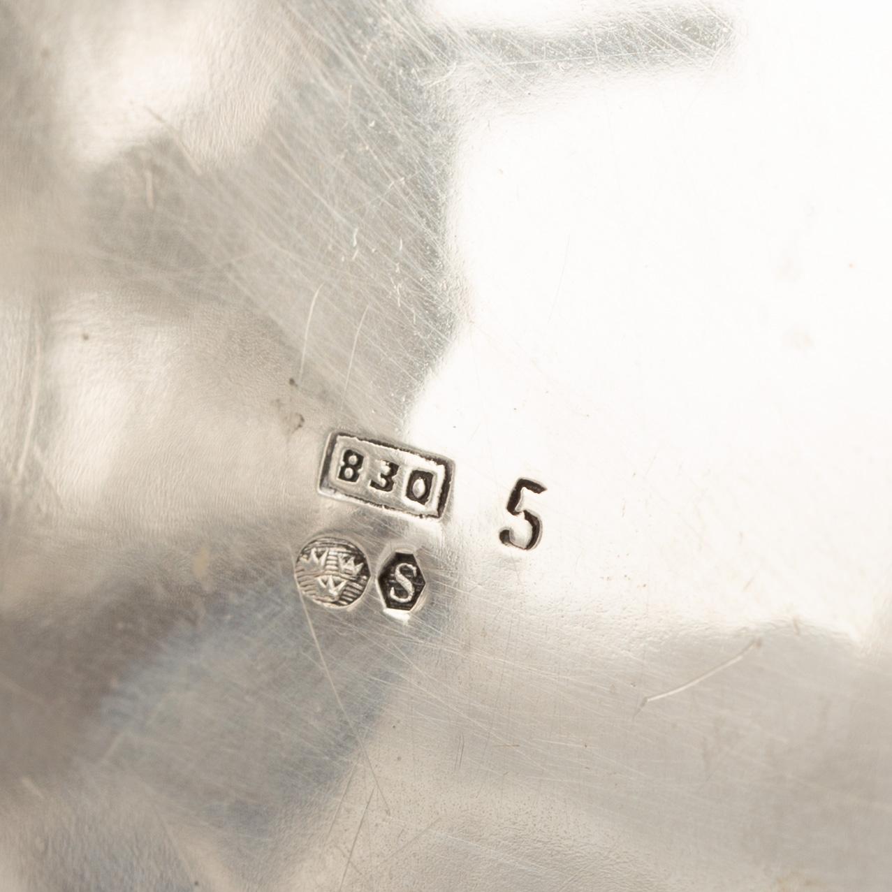 A Rococo-style silver coffee pot, creamer and sugar bowl, 20th Century.