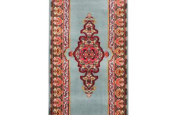 An oriental runner, c. 550 x 74 cm.