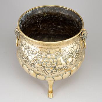 A 19th century brass champagne cooler.