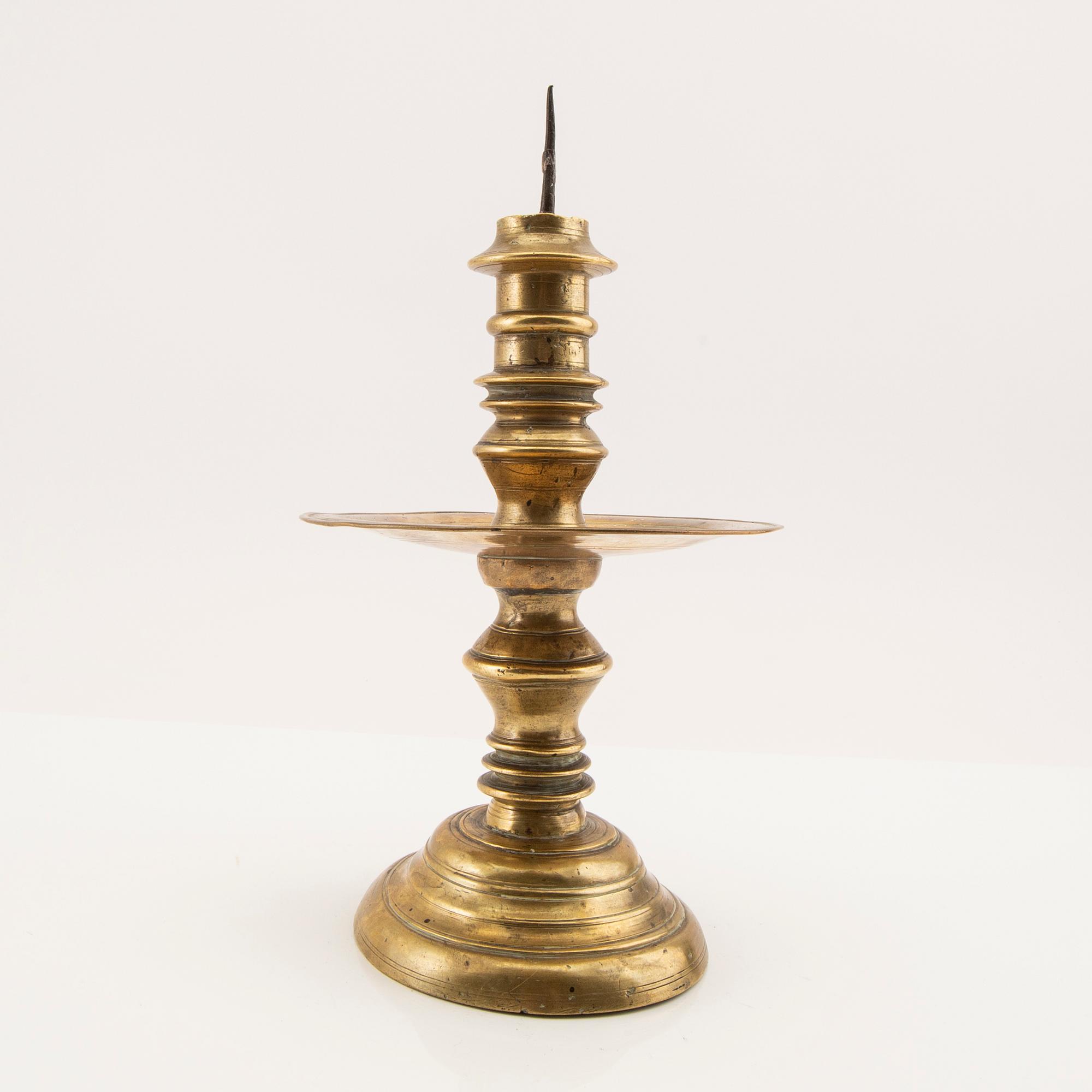 Candle holder possibly from the 17th century, brass.