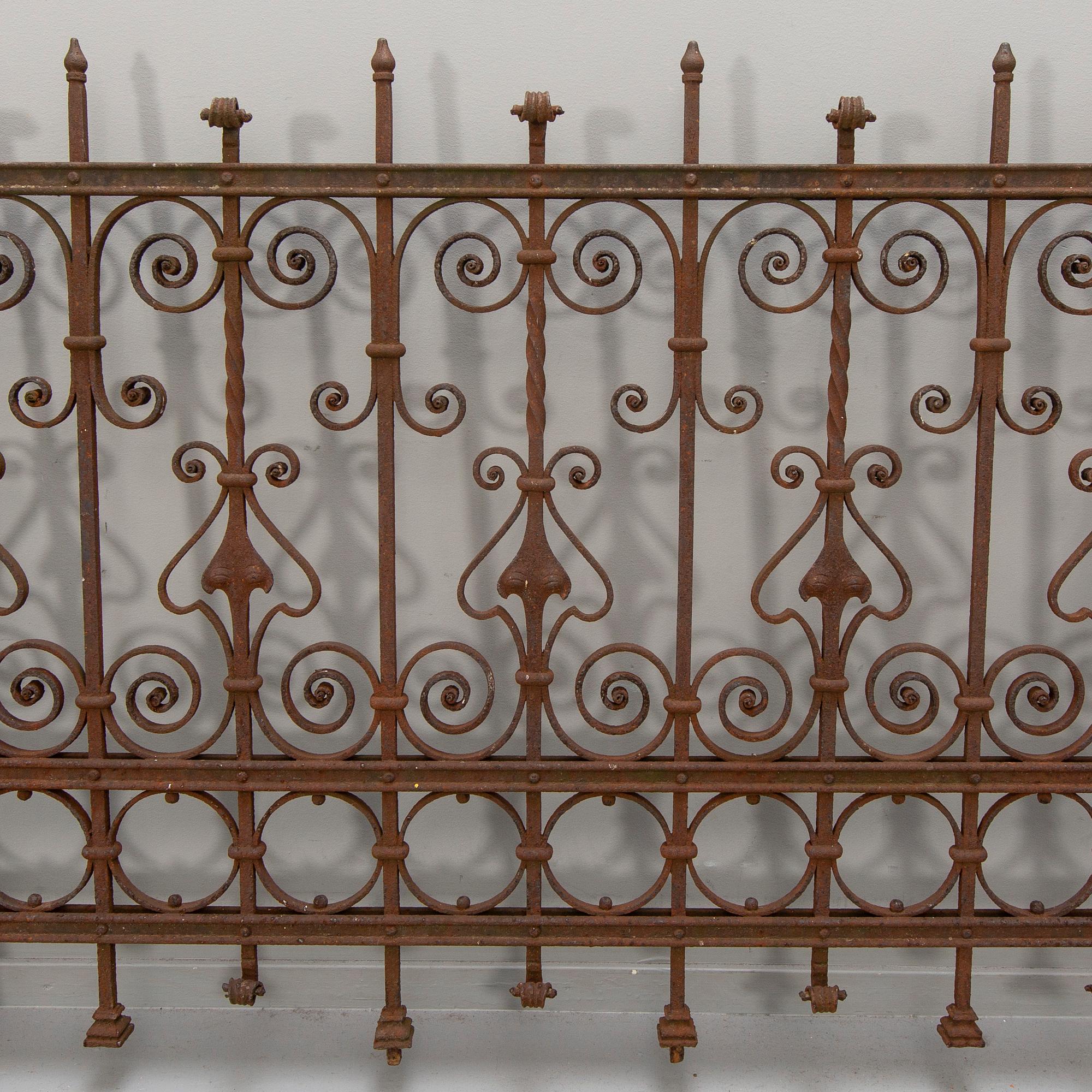 A cast iron two part fence around 1900.