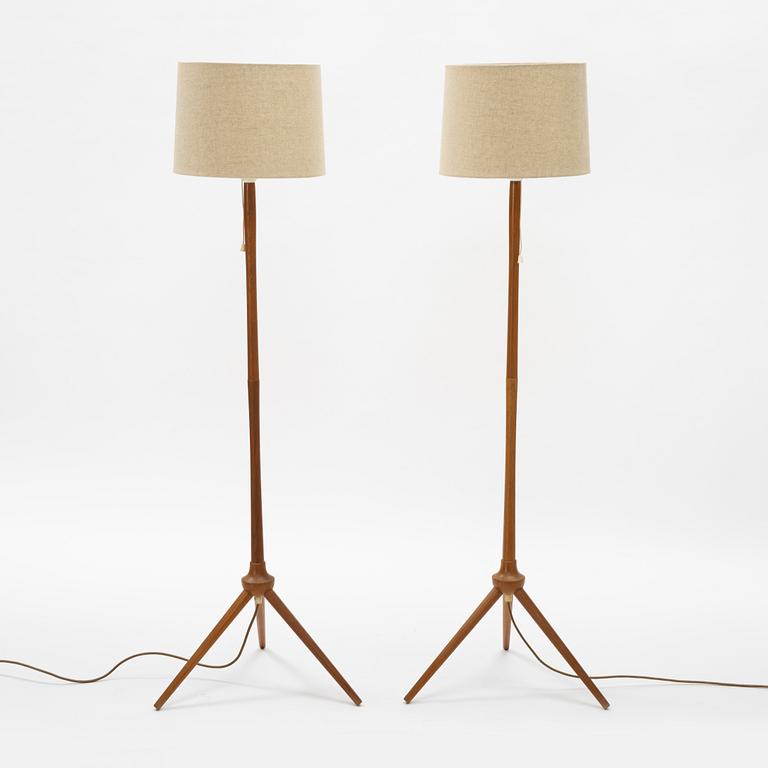 A pair of teak floor lamps, mid 20th century.