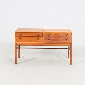 A 1960s teak side table.