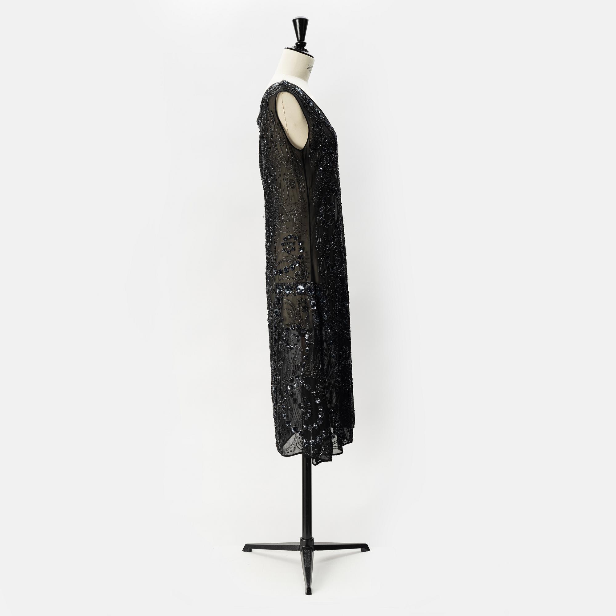 A pearl and sequin embroidered 1920's dress.