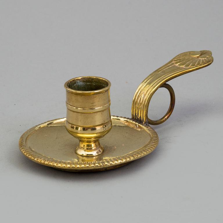 A 18th century bronze candlestick.