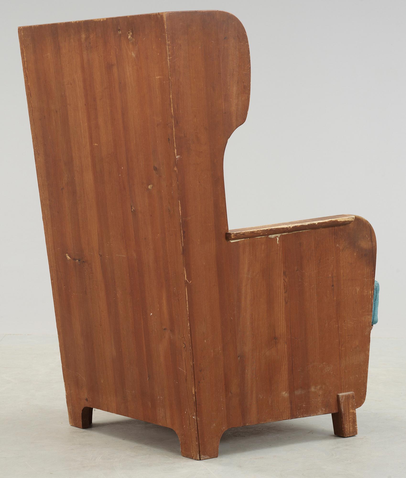 An Axel Einar Hjorth 'Lovö' stained pine armchair, Nordiska Kompaniet, Sweden 1930's.
