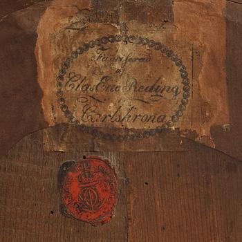 A late gustavian girandole mirror signed by Claes Eric Reding, Karlskrona, (master 1808-1815).