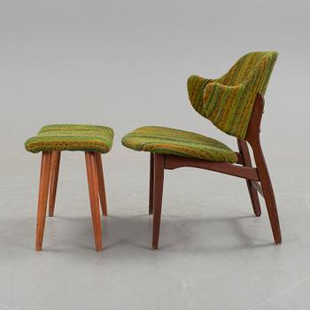 An IKEA armchair with a stool.