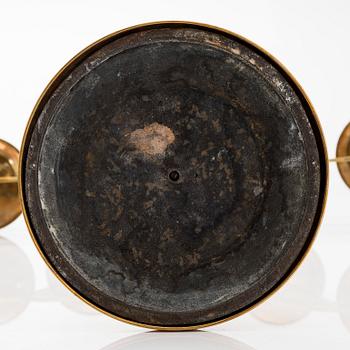 A pair of brass candelabras, early 20th century.