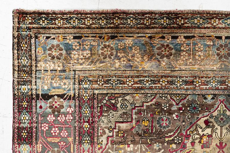 An antique silk Kashan rug, Central Persia, c. 207 x 131 cm.