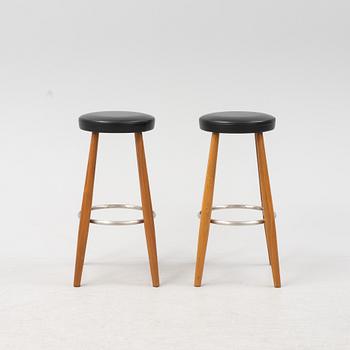 Hans J Wegner, a pair of bar stools, model 'CH58', Carl Hansen & Søner, Denmark.