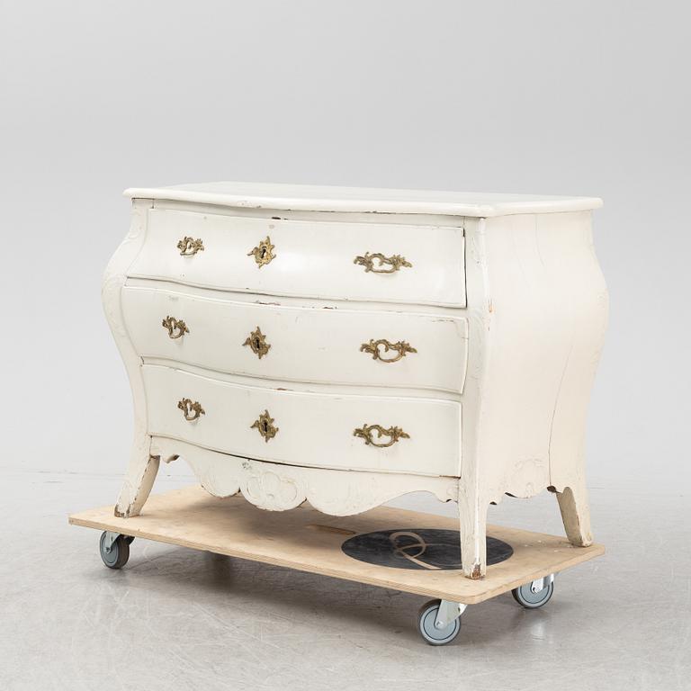 A painted rococo chest of drawers, mid 18th Century.