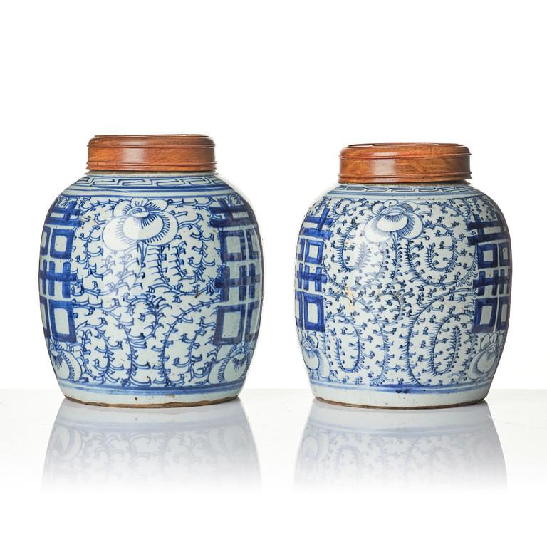 A pair of blue and white porcelain pots with covers, China, 19th century.