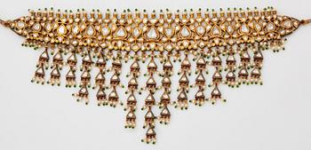 An Indian demi parure comprising a necklace and a pair of earrings.