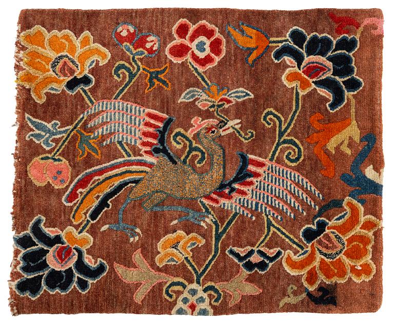 An antique 'Khagangma' rug, Tibet, around 1900. c. 74x63 cm.