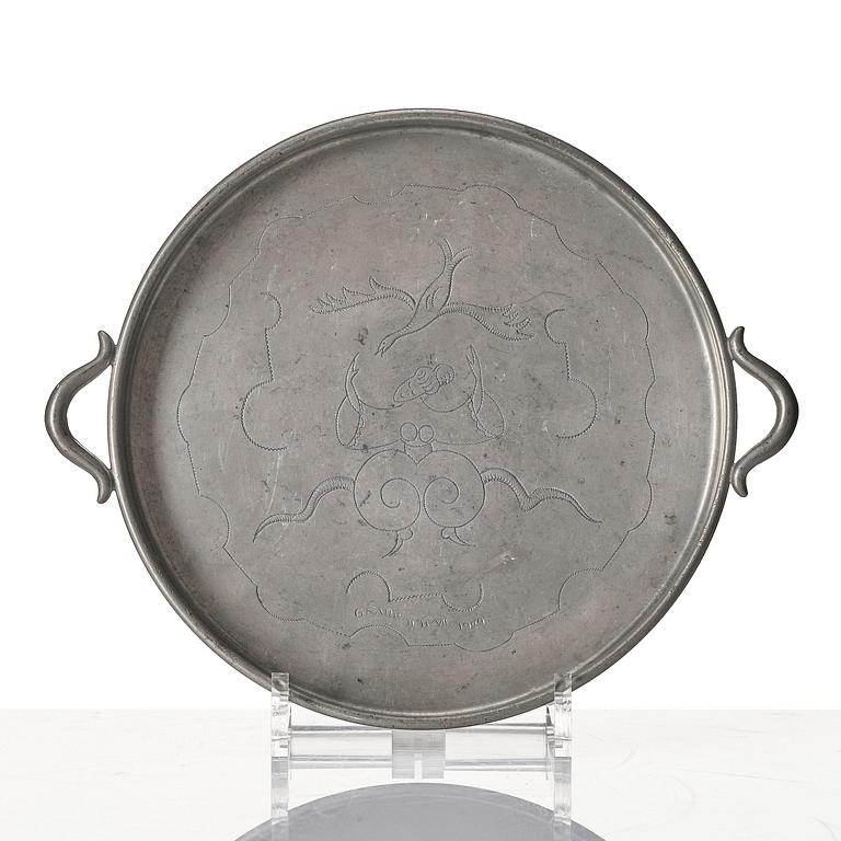 Firma Svenskt Tenn, a set of two pewter trays, Stockholm, 1930 and 1927.