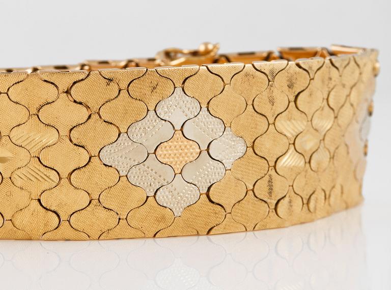 ARMBAND, 18K tvåfärgat guld, utländska stämplar. Vikt 52,9 gram.
