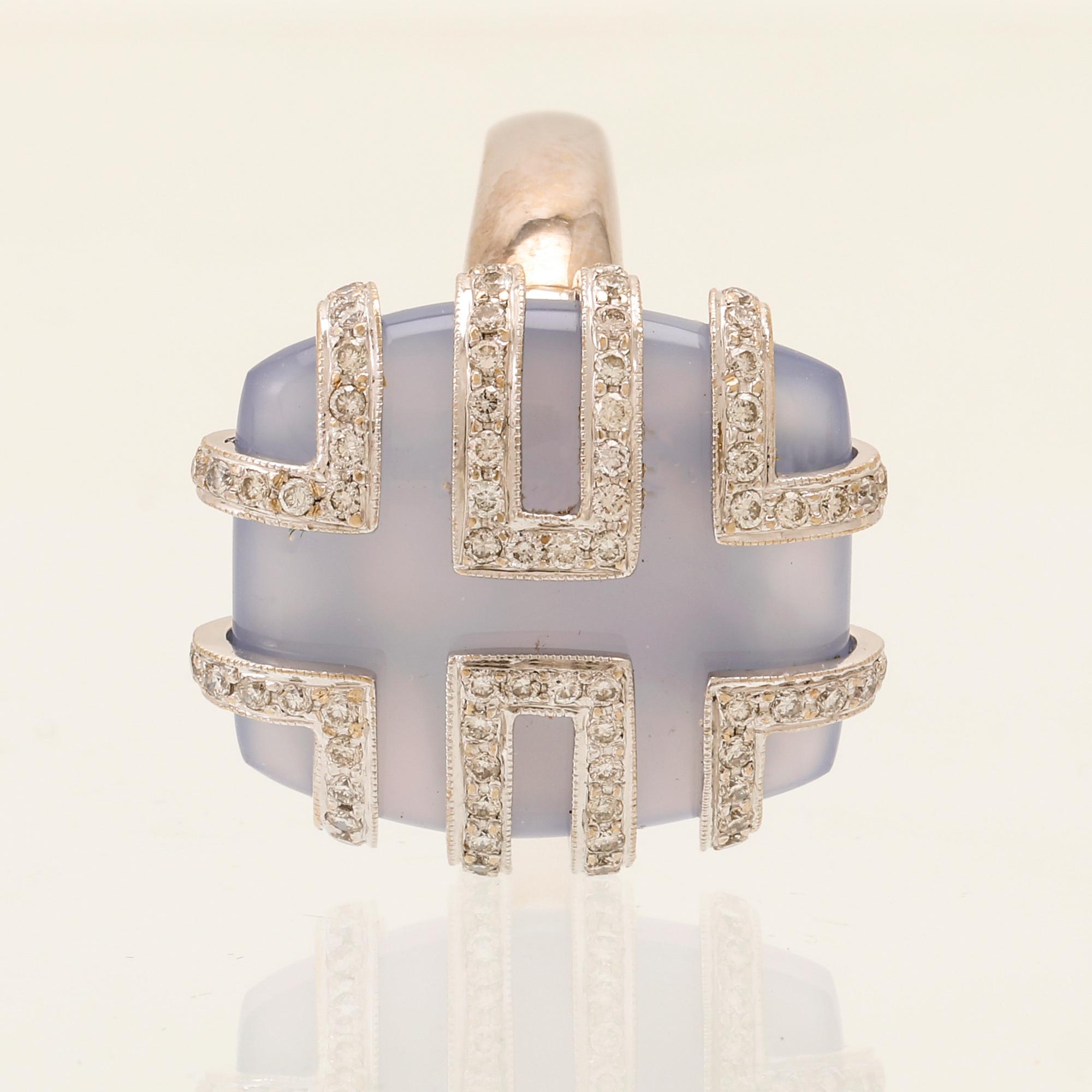 An 18K white gold ring with brilliant cut diamonds and possibly chalcedony.