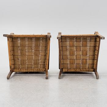 A pair of stained beech armchairs, first half of the 20th Century.