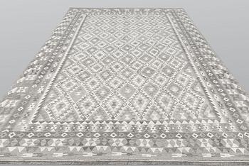 A carpet, kilim, ca 390 x 298 cm.