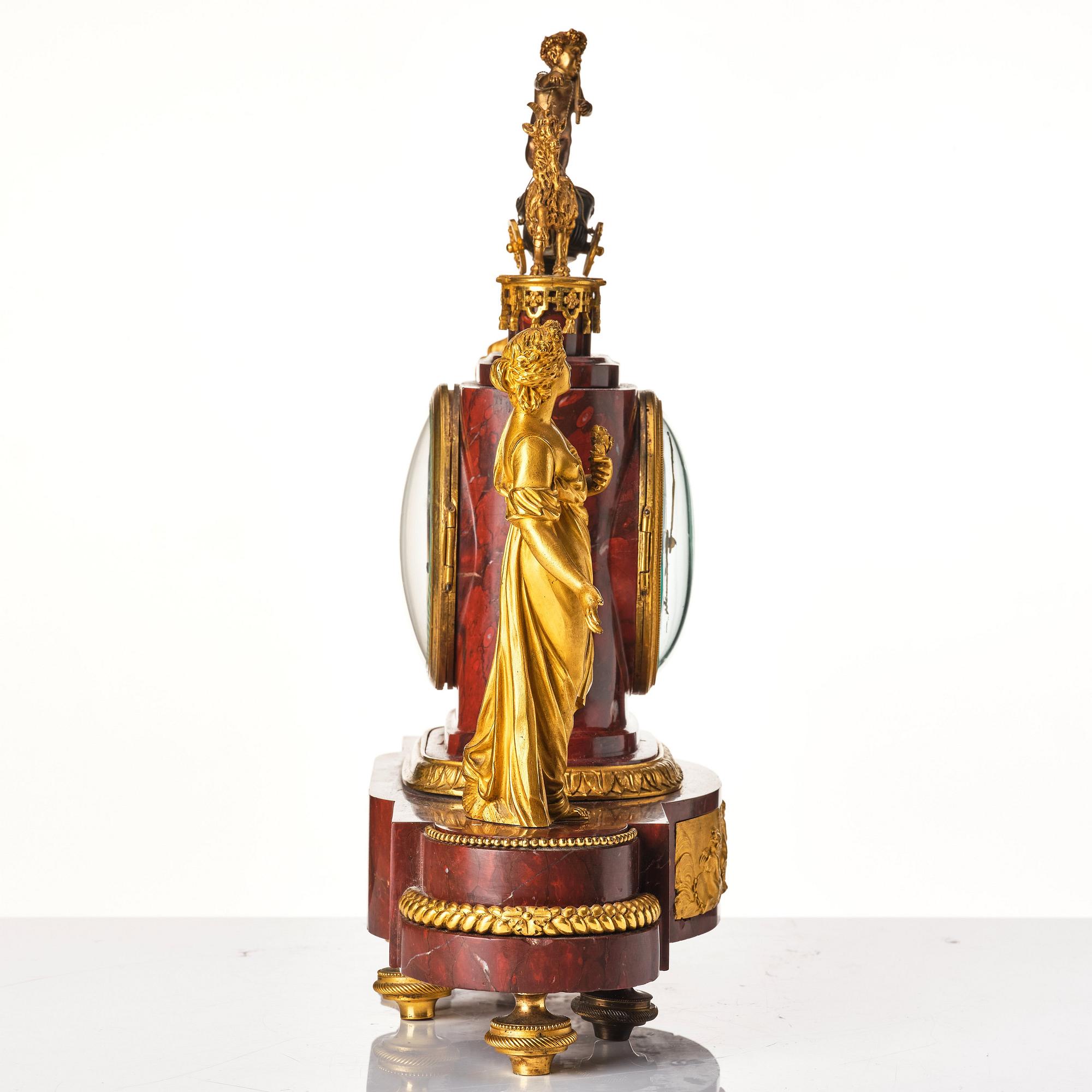 A French Empire 19th century gilt bronze mantel clock signed Lamiral.