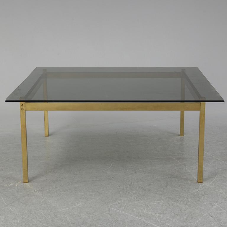 A 1960-70's brass and glass coffee table.
