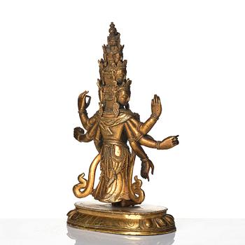 A Tibeto-Chinese gilt bronze figure of Avalokiteshvara Ekasdashamukra, 19th century.