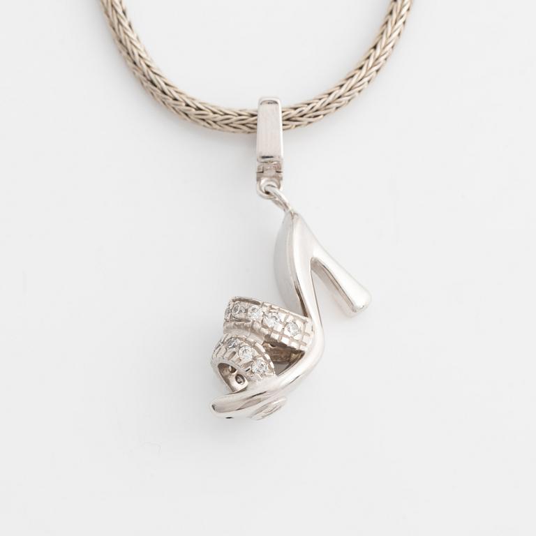 18K white gold shoe pendant with faceted white stones, silver chain.
