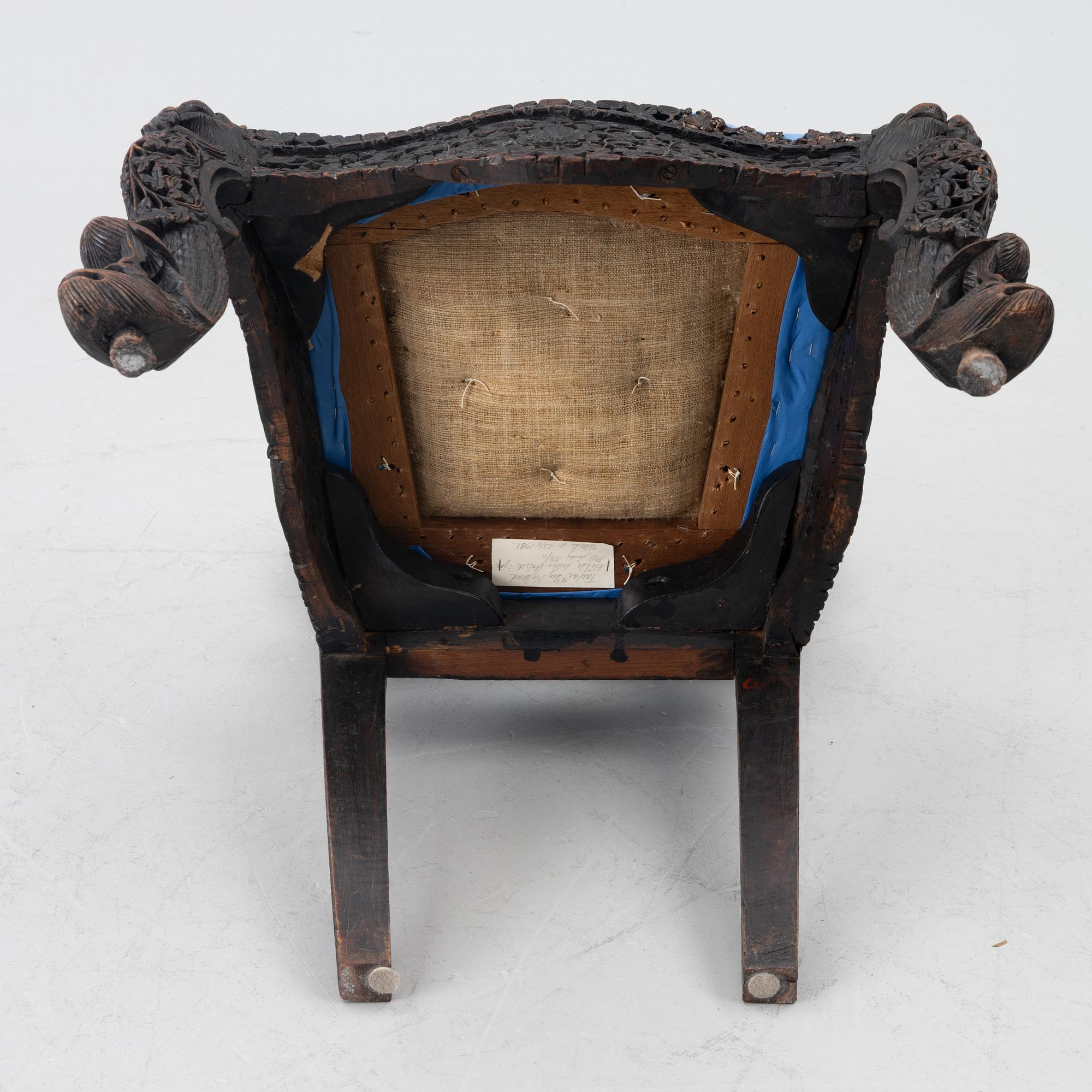A carved 'blackwood' armchair.  bombay presidency circa 1880.