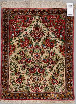 A rug silk Qum, around 70 x 55 cm.