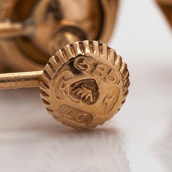 A pair of 14K gold earrings with cultured pearls.