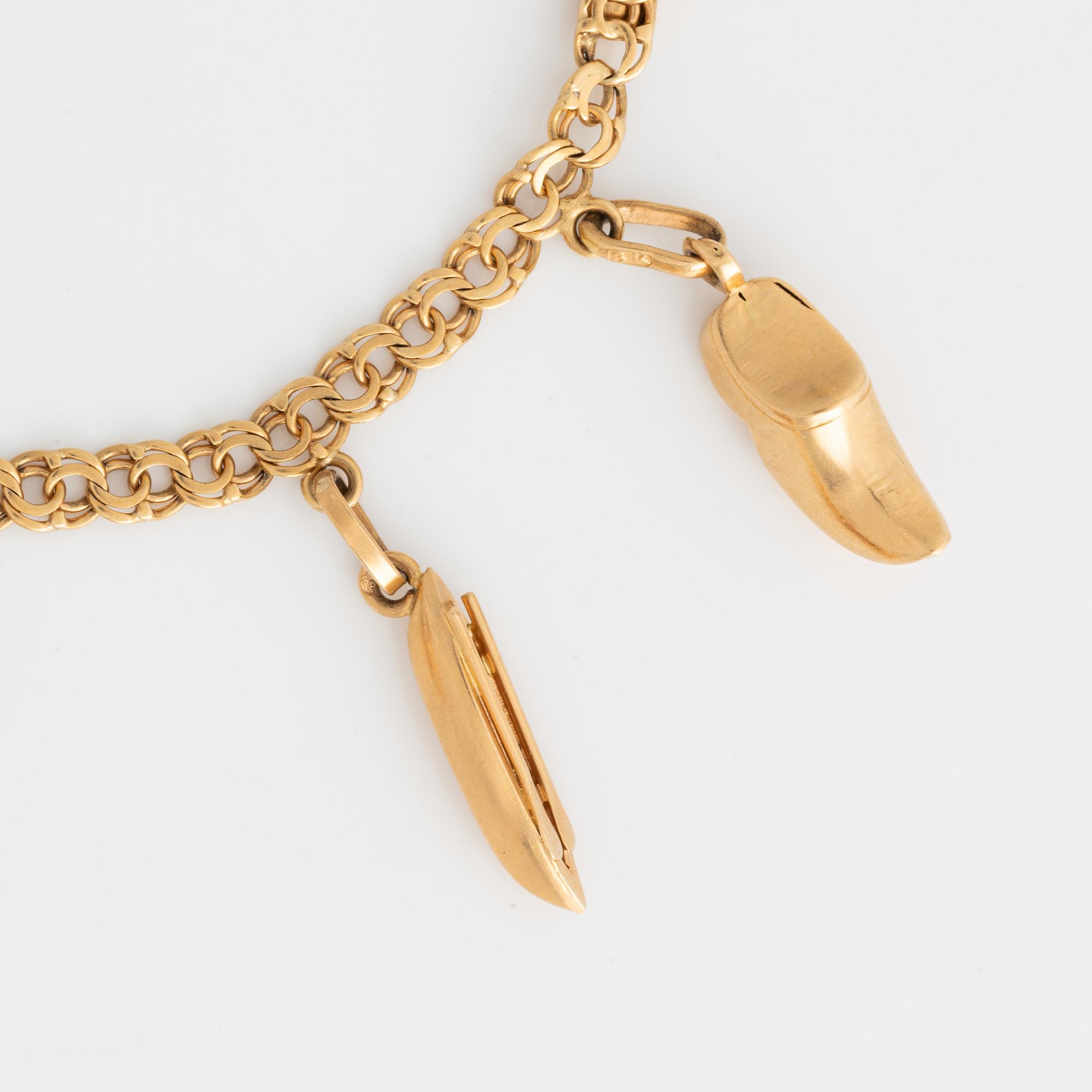 Armband med berlocker 18K guld.