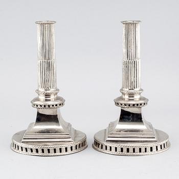 A pair of candlesticks in silver-plated pewter, by Gottlob Friedrich Baumann in Hudiksvall, 1794 and 1799.