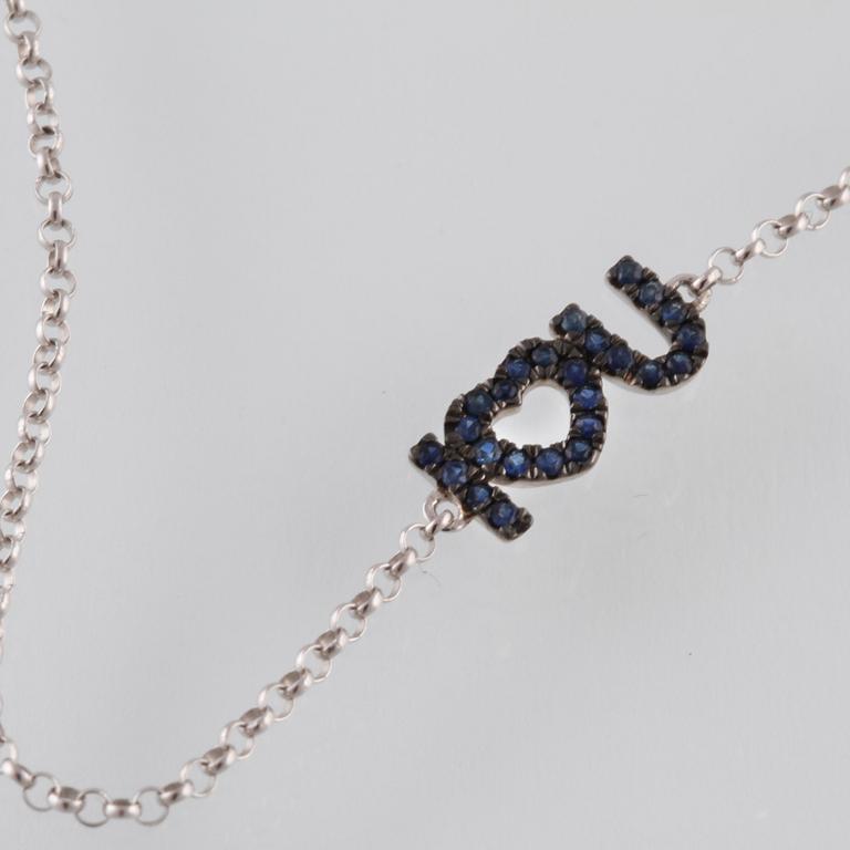ARMBAND, 18K vitguld med fasettslipade blå safirer. Vikt 1,1 gram.