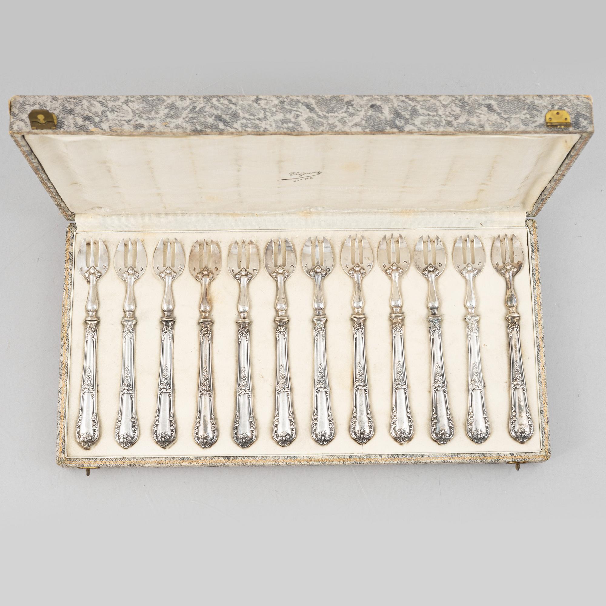 A set of twelve French silver oyster forks, mark of Louis Coignet