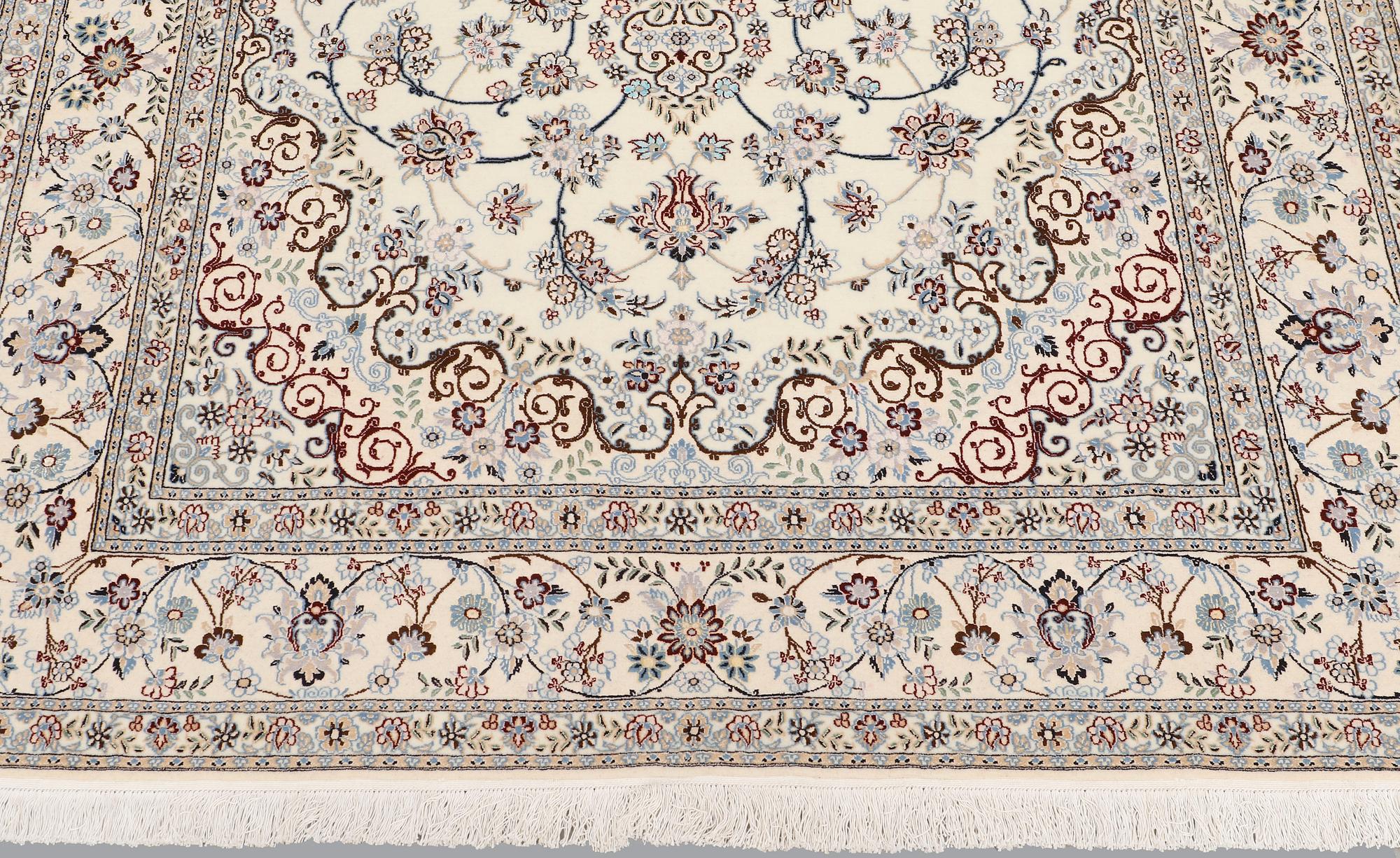 A Nain part silk carpet, 244 x 156 cm.