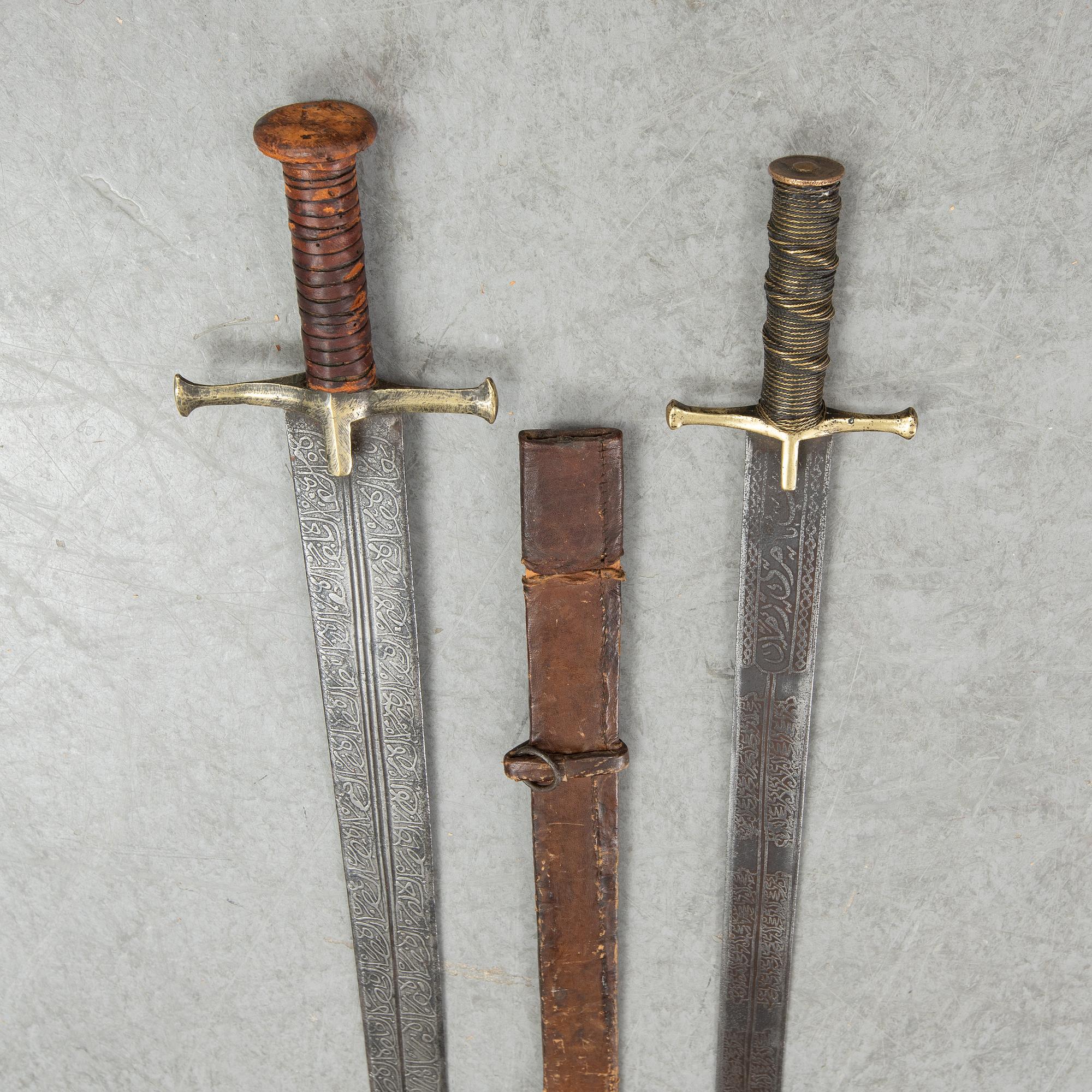 Two East African Kaskara swords- One with scabbard. 19-20th Century.