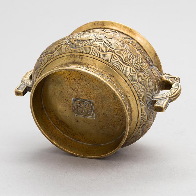 A 20th-century bronze incense burner, marked Hu Wenming.